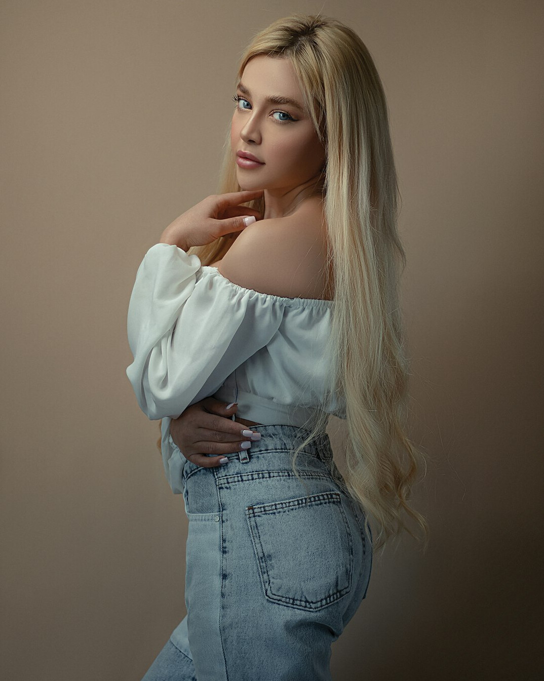 Studio portrait of a woman with long blonde hair